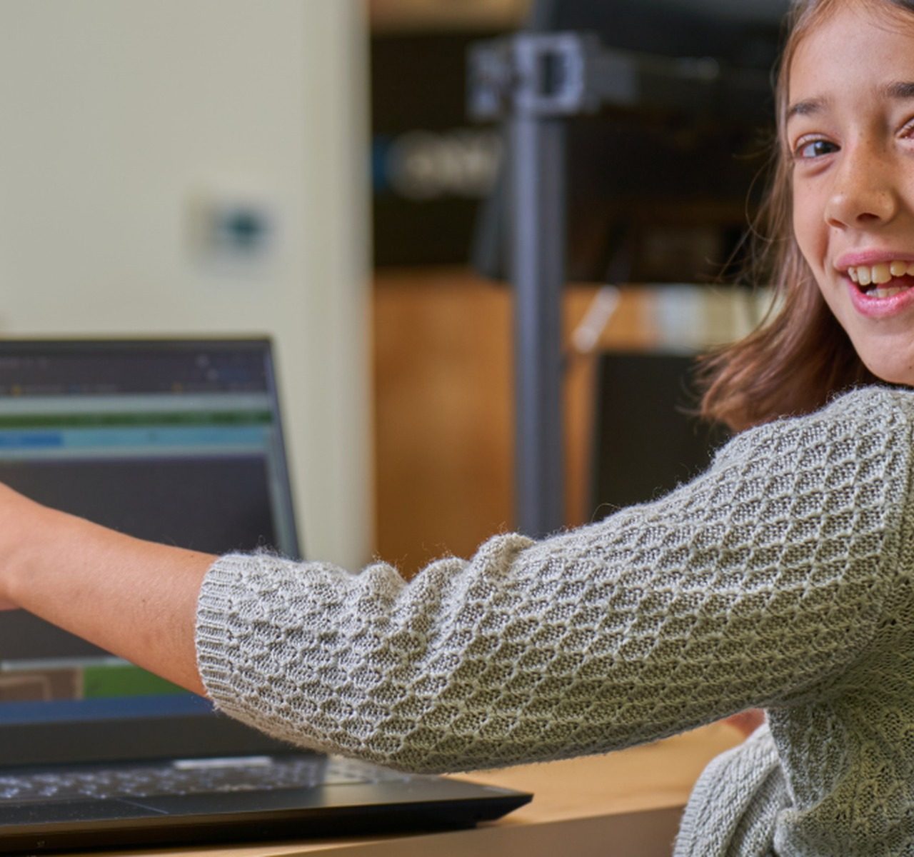Child enjoying a coding activity on a computer at Code Ninjas.